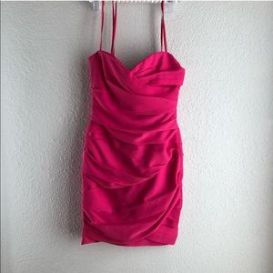 Hot pink strapless body con ruched midi dress